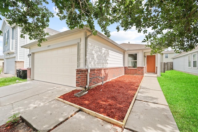 18935 Remington Bend Dr, Houston, TX 77073 - view of front of house with brick siding, an attached garage, a front yard, and concrete driveway