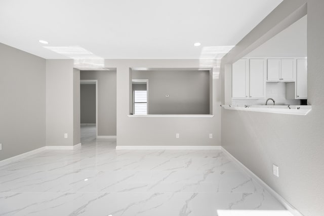 18935 Remington Bend Dr, Houston, TX 77073 - unfurnished room featuring light marble finish flooring and recessed lighting