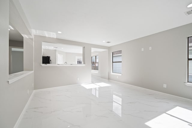 18935 Remington Bend Dr, Houston, TX 77073 - spare room featuring marble finish floors and recessed lighting