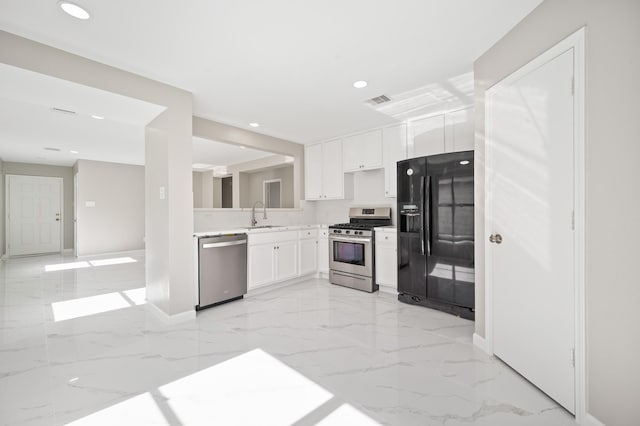18935 Remington Bend Dr, Houston, TX 77073 - kitchen with stainless steel appliances, light marble finish floors, recessed lighting, white cabinets, and light countertops