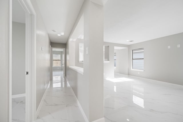 18935 Remington Bend Dr, Houston, TX 77073 - hallway with light marble finish floors and baseboards