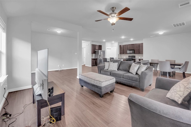 12326 Sabine Point Dr, Humble, TX 77346 - living room with ceiling fan, light wood-style flooring, and recessed lighting