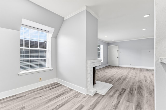 2501 Marilee Ln Unit 4, Houston, TX 77057 - foyer featuring a brick fireplace, crown molding, wood finished floors, and recessed lighting