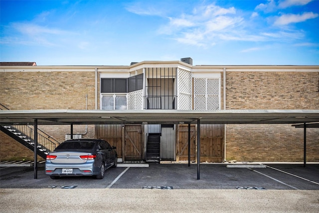 2501 Marilee Ln Unit 4, Houston, TX 77057 - view of property featuring covered parking and stairs
