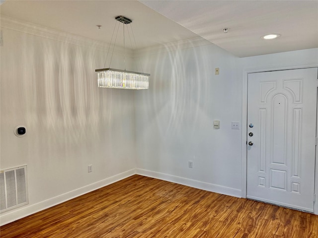 2299 Lone Star Dr Unit 308, Sugar Land, TX 77479 - unfurnished room featuring a chandelier and wood finished floors