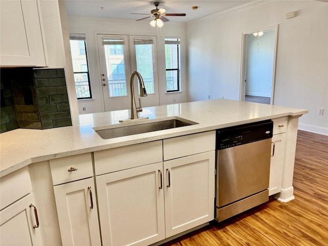 2299 Lone Star Dr Unit 308, Sugar Land, TX 77479 - kitchen with dishwasher, crown molding, ceiling fan, light wood finished floors, and white cabinetry