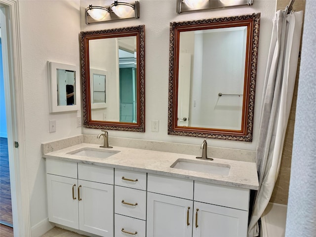 2299 Lone Star Dr Unit 308, Sugar Land, TX 77479 - bathroom featuring double vanity and shower / bathtub combination with curtain
