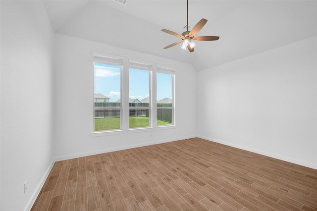 30218 Indigo Falls Dr, Brookshire, TX 77423 - empty room featuring wood finished floors, ceiling fan, and lofted ceiling
