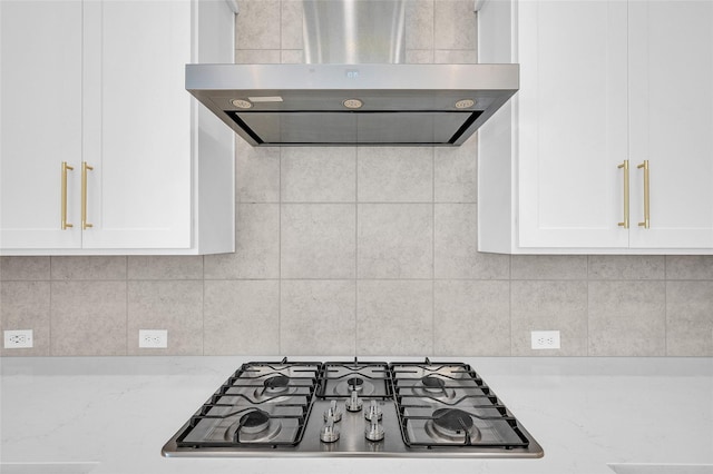 30218 Indigo Falls Dr, Brookshire, TX 77423 - kitchen with exhaust hood, stainless steel gas cooktop, white cabinets, decorative backsplash, and light stone counters