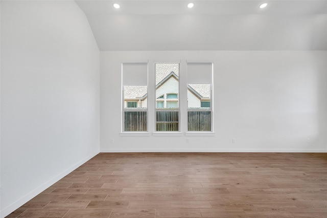 30218 Indigo Falls Dr, Brookshire, TX 77423 - unfurnished room with vaulted ceiling, wood finished floors, healthy amount of natural light, and recessed lighting