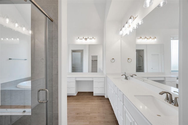 30218 Indigo Falls Dr, Brookshire, TX 77423 - full bathroom with double vanity, a stall shower, wood finished floors, and a tub to relax in