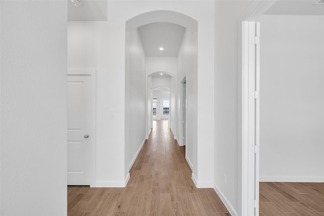 30218 Indigo Falls Dr, Brookshire, TX 77423 - corridor with arched walkways, light wood-type flooring, and recessed lighting