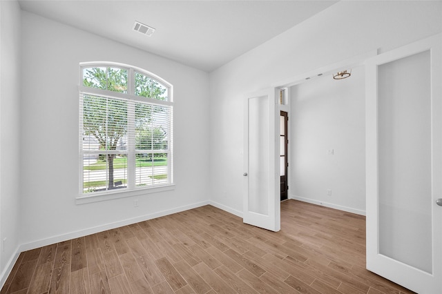 30218 Indigo Falls Dr, Brookshire, TX 77423 - unfurnished room with light wood finished floors and baseboards