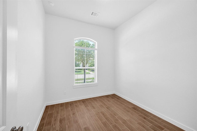 30218 Indigo Falls Dr, Brookshire, TX 77423 - empty room with dark wood-style floors and a smoke detector