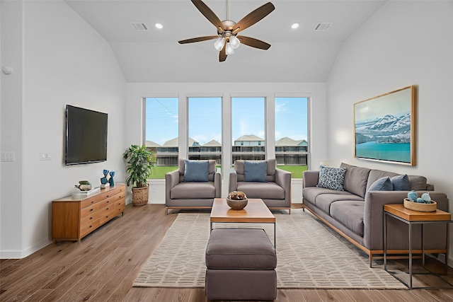 30218 Indigo Falls Dr, Brookshire, TX 77423 - living room with lofted ceiling, ceiling fan, wood finished floors, and recessed lighting