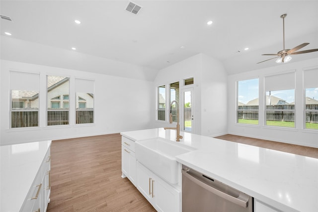 30218 Indigo Falls Dr, Brookshire, TX 77423 - kitchen with dishwasher, open floor plan, light wood finished floors, light countertops, and recessed lighting