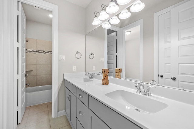 5715 Caper Shores Ln, Sugar Land, TX 77479 - full bath with tile patterned floors, double vanity, and shower / bathtub combination