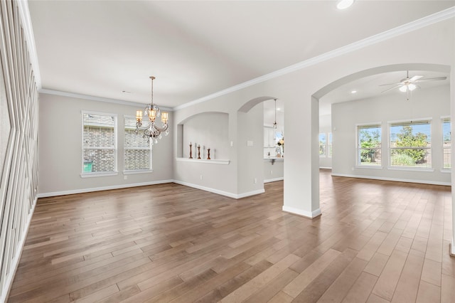 5715 Caper Shores Ln, Sugar Land, TX 77479 - empty room with a chandelier, healthy amount of natural light, a ceiling fan, wood finished floors, and crown molding