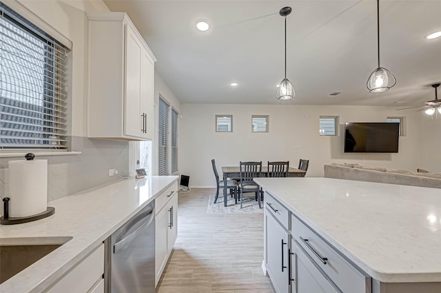 3226 Longleaf Meadows Dr, Houston, TX 77063 - kitchen featuring dishwasher, white cabinetry, a ceiling fan, pendant lighting, and light wood-style flooring