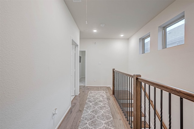 3226 Longleaf Meadows Dr, Houston, TX 77063 - hallway with light wood-style flooring, attic access, recessed lighting, and an upstairs landing