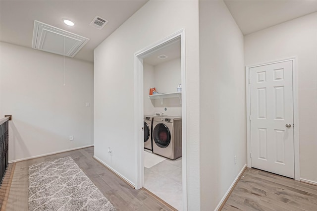 3226 Longleaf Meadows Dr, Houston, TX 77063 - laundry area with attic access, washer and dryer, wood finished floors, and recessed lighting