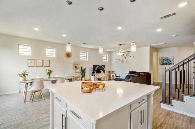 3226 Longleaf Meadows Dr, Houston, TX 77063 - kitchen with healthy amount of natural light, light wood finished floors, a ceiling fan, light countertops, and recessed lighting