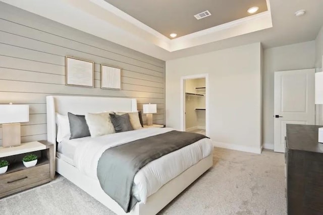3226 Longleaf Meadows Dr, Houston, TX 77063 - bedroom featuring a tray ceiling, wooden walls, recessed lighting, and light colored carpet