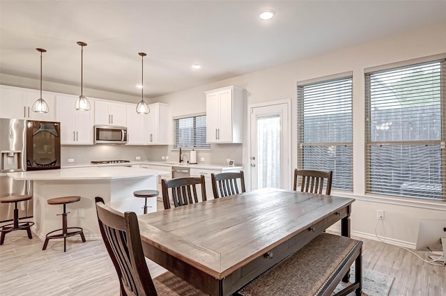 3226 Longleaf Meadows Dr, Houston, TX 77063 - dining area featuring light wood-style flooring and recessed lighting