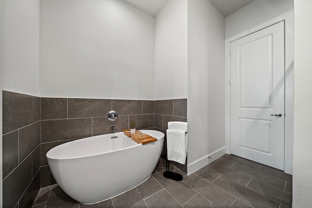 3929 Tulane Oak Dr, Houston, TX 77018 - bathroom featuring a soaking tub and tile walls