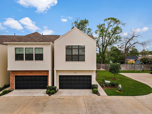 3929 Tulane Oak Dr, Houston, TX 77018 - view of front facade with driveway, an attached garage, and stucco siding