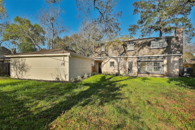 12707 Pleasant Grove Rd, Cypress, TX 77429 - rear view of house with a lawn, a chimney, brick siding, mansard roof, and a shingled roof