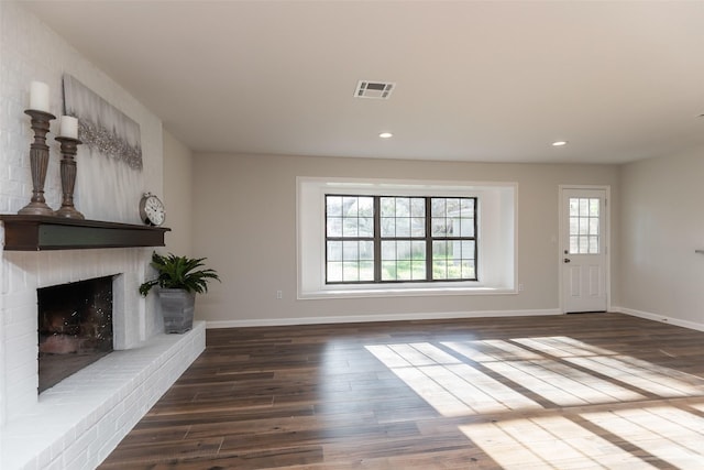 12707 Pleasant Grove Rd, Cypress, TX 77429 - unfurnished living room with wood finished floors, a fireplace, and recessed lighting
