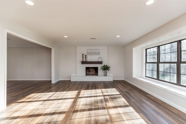 12707 Pleasant Grove Rd, Cypress, TX 77429 - unfurnished living room with wood finished floors, recessed lighting, and a fireplace