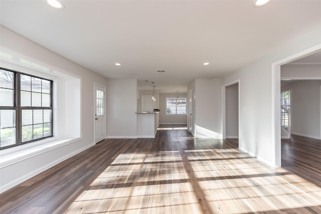12707 Pleasant Grove Rd, Cypress, TX 77429 - unfurnished living room featuring recessed lighting, dark wood-style flooring, and a chandelier