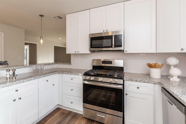 12707 Pleasant Grove Rd, Cypress, TX 77429 - kitchen with stainless steel appliances, backsplash, and white cabinetry