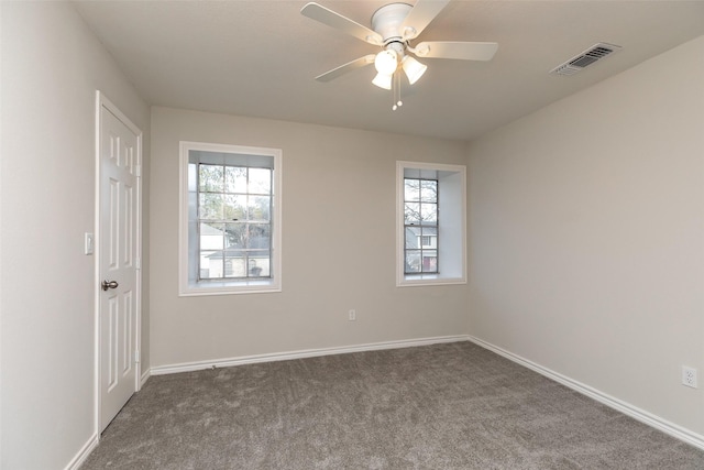 12707 Pleasant Grove Rd, Cypress, TX 77429 - empty room with dark colored carpet, plenty of natural light, and ceiling fan