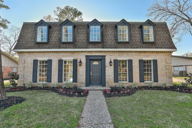 12707 Pleasant Grove Rd, Cypress, TX 77429 - view of front of house featuring mansard roof, roof with shingles, and a front yard