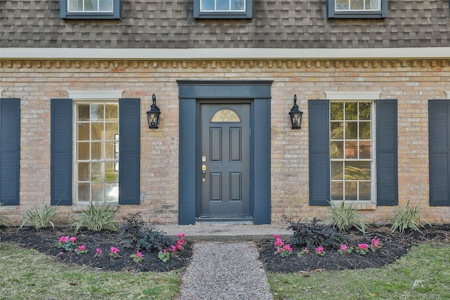 12707 Pleasant Grove Rd, Cypress, TX 77429 - entrance to property featuring a shingled roof, mansard roof, and brick siding
