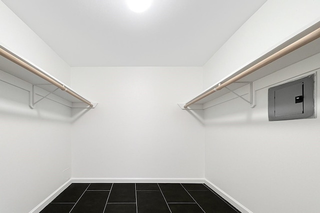 12905 Woodforest Blvd Unit 709, Houston, TX 77015 - walk in closet with electric panel and dark tile patterned floors