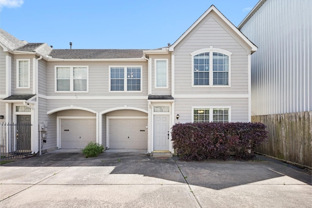 1708 Dennis St, Houston, TX 77004 - view of front of home with driveway, a garage, and a shingled roof