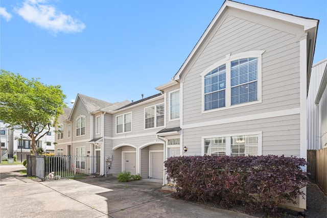 1708 Dennis St, Houston, TX 77004 - townhome / multi-family property with driveway, a garage, and a residential view