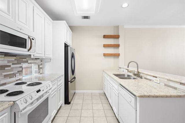 1708 Dennis St, Houston, TX 77004 - kitchen with white appliances, open shelves, a peninsula, tasteful backsplash, and white cabinets