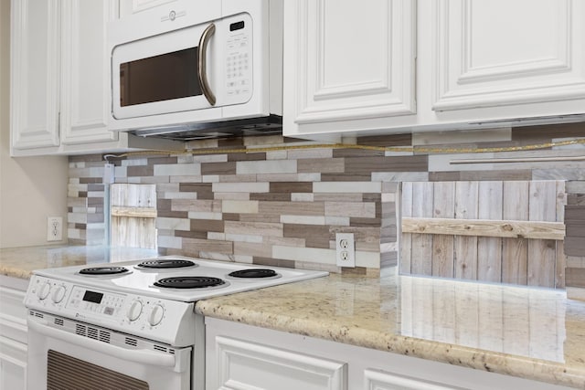 1708 Dennis St, Houston, TX 77004 - kitchen with white appliances, white cabinetry, backsplash, and light stone countertops