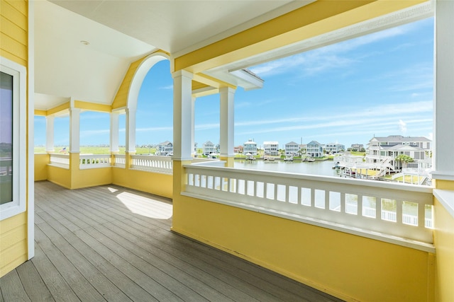 20611 E Sunset Bay Dr, Galveston, TX 77554 - unfurnished sunroom with a water view and wood finished floors