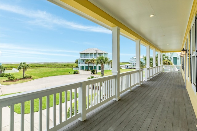 20611 E Sunset Bay Dr, Galveston, TX 77554 - wooden porch with a water view