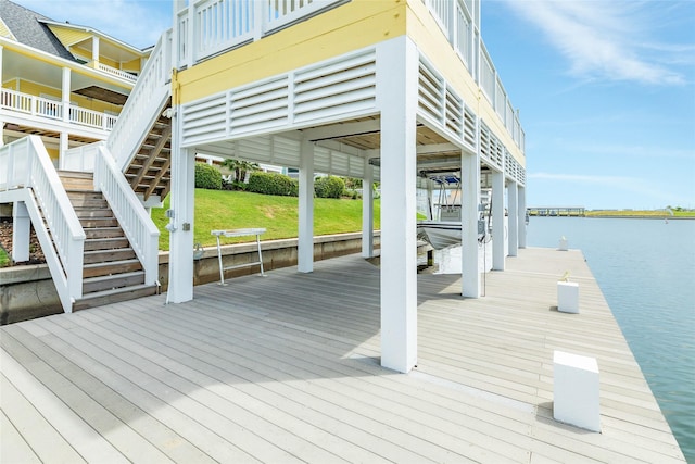 20611 E Sunset Bay Dr, Galveston, TX 77554 - dock featuring a water view, boat lift, a yard, and stairway