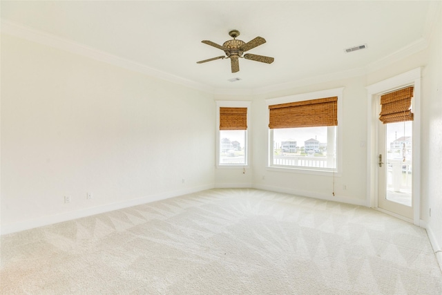 20611 E Sunset Bay Dr, Galveston, TX 77554 - unfurnished room featuring crown molding, light colored carpet, and a ceiling fan
