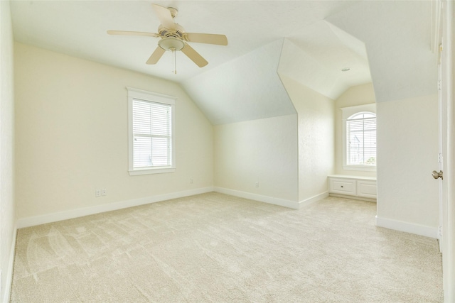 20611 E Sunset Bay Dr, Galveston, TX 77554 - additional living space featuring healthy amount of natural light, light carpet, vaulted ceiling, and a ceiling fan