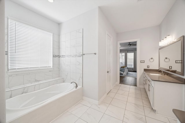 1120 Wakefield Dr, Houston, TX 77018 - ensuite bathroom with a bath, vanity, marble look tiles, and a ceiling fan