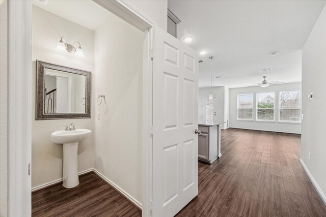 10967 Cannes Memorial Dr, Houston, TX 77043 - corridor with dark wood-style flooring and baseboards